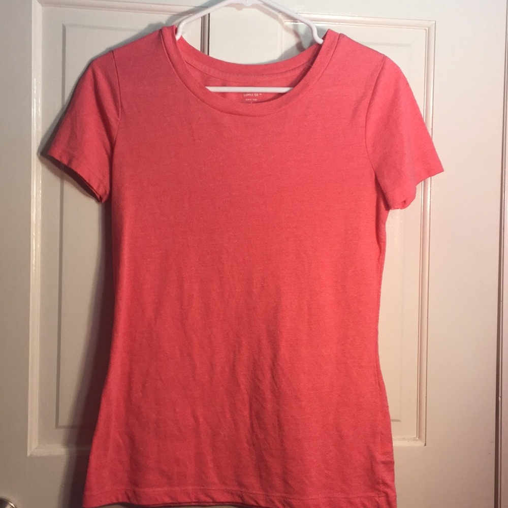 Pink tee shirt.